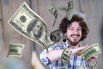 Image showing businessman making the rain of money