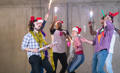 Image showing multiethnic group of casual business people dancing with sparkle