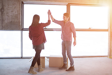 Image showing business team carrying cardboard boxes