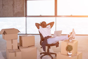 Image showing young black casual businessman taking a break on construction si