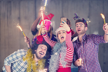 Image showing multiethnic group of casual business people taking selfie during