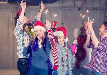 Image showing multiethnic group of casual business people dancing with sparkle