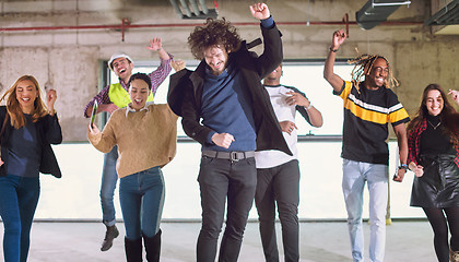 Image showing young multiethnic business people dancing in unfinished startup 