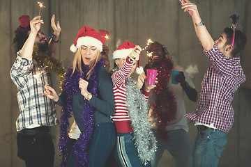 Image showing multiethnic group of casual business people dancing with sparkle