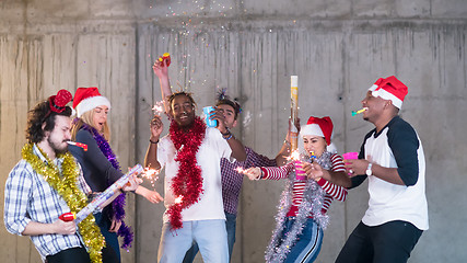 Image showing multiethnic group of casual business people having confetti part