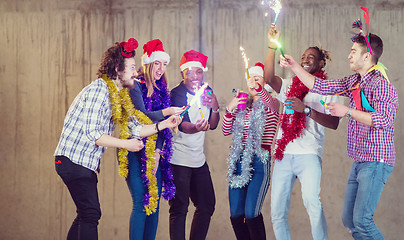 Image showing multiethnic group of casual business people dancing with sparkle