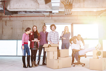 Image showing portrait of multiethnic business people with sunlight through th