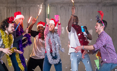 Image showing multiethnic group of casual business people having confetti part