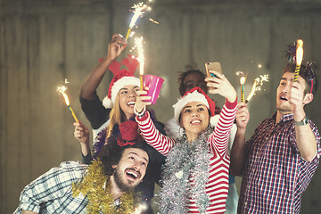 Image showing multiethnic group of casual business people taking selfie during