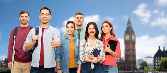 Image showing group of students showing thumbs up over london