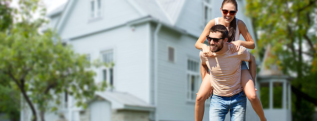 Image showing couple having fun in summer over house background