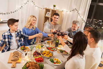 Image showing happy family having dinner party at home