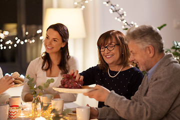 Image showing happy family having tea party at home