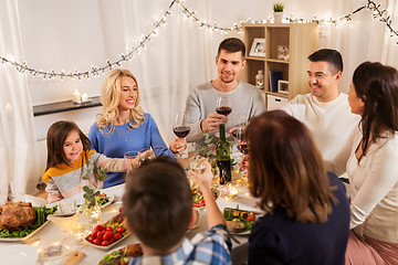 Image showing happy family having dinner party at home