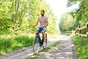 Image showing man riding fixie bicycle at summer park