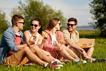Image showing friends eating pizza at picnic in summer park