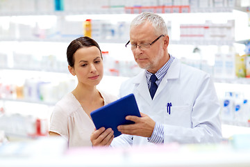 Image showing apothecary and customer with tablet pc at pharmacy