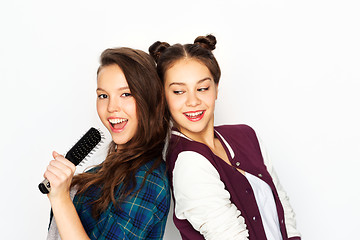 Image showing teenage girls singing to hairbrush and having fun