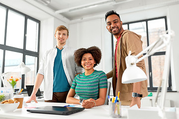 Image showing happy creative team with laptop at office