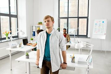 Image showing man standing at office table