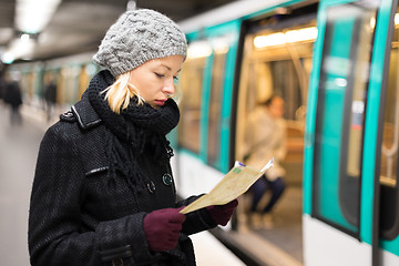 Image showing Lady waiting on subway station platform.