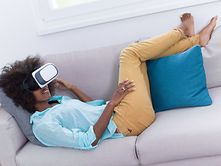 Image showing black woman using VR headset glasses of virtual reality