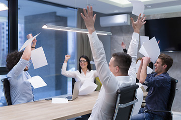 Image showing startup Group of young business people throwing documents