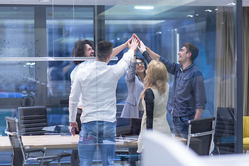 Image showing startup Group of young business people celebrating success