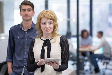 Image showing Business People Working With Tablet in startup office