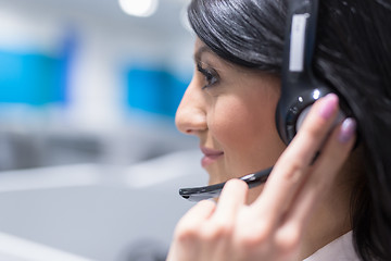 Image showing female call centre operator doing her job