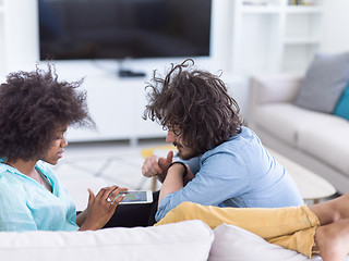 Image showing multiethnic couple in living room