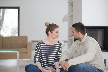 Image showing Young Couple using digital tablet on cold winter day