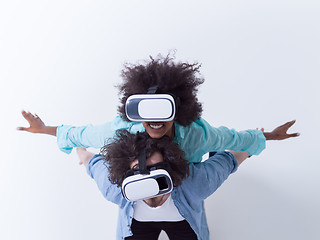 Image showing multiethnic couple getting experience using VR headset glasses