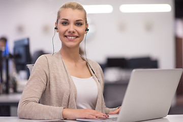 Image showing businesswoman using a laptop in startup office