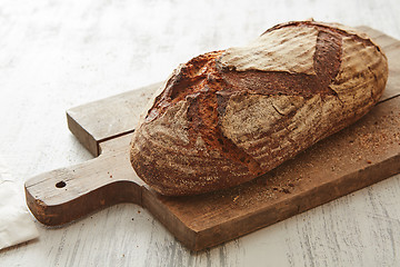 Image showing Fresh bread on wooden board