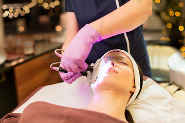 Image showing young woman having face microdermabrasion at spa