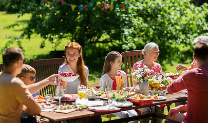 Image showing happy family having dinner or summer garden party