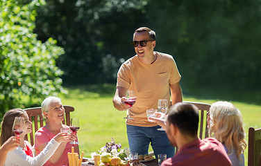 Image showing happy family having dinner or summer garden party