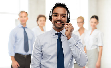 Image showing indian businessman or helpline operator in headset