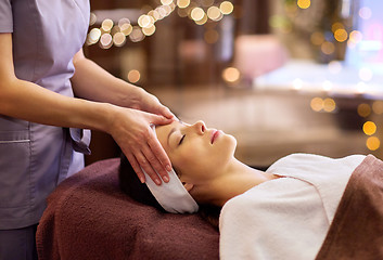 Image showing woman having face and head massage at spa