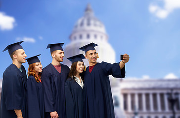 Image showing graduates taking selfie by smartphone