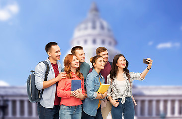 Image showing students taking selfie over capitol building