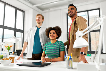 Image showing happy creative team with laptop at office