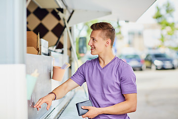 Image showing male customer with wallet at food truck