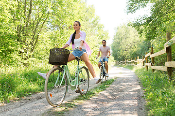 Image showing happy couple with bicycles at summer park