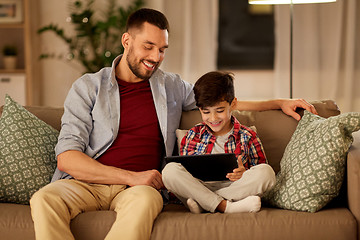 Image showing father and son with tablet pc playing at home