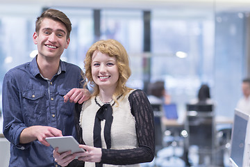 Image showing Business People Working With Tablet in startup office