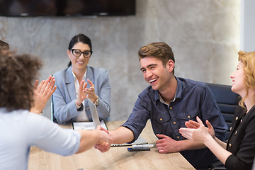 Image showing cloasing the deal in modern office interior