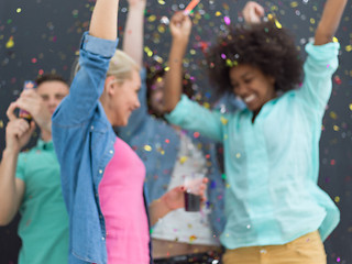 Image showing confetti party multiethnic group of people isolated over gray