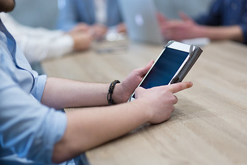 Image showing businessman using tablet computer